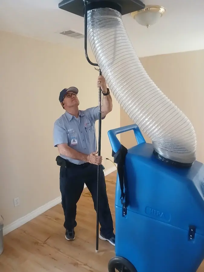 Furnace Tune-Up technician using HEPA equipment in Lincoln